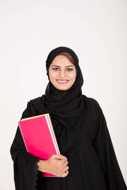 istock Young pretty arab muslim female student 643886752