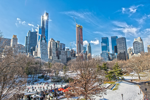 Central Park and Skyline in Winter with Ice Rink and Snow