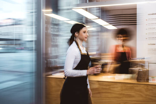 istock Waitress walking with a cup of coffee 643893740