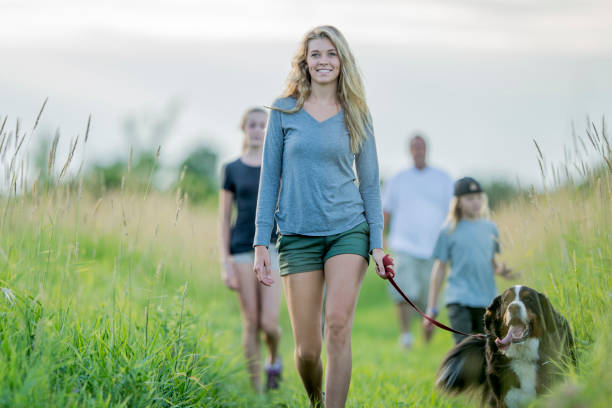 istock Family Walking Their Dog 643898172