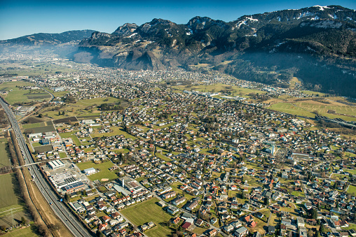 Aerial photography from the village Altach taken from a plane flying above the Rhine Valley in Vorarlberg, Austria, close to the border of Switzerland.