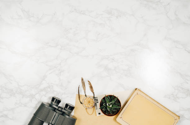 istock Travel accessories top view white marble background with copy space 643898740