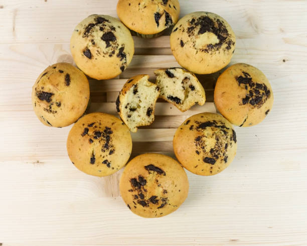 istock Square of muffins with chocolate drops on wood 643899156