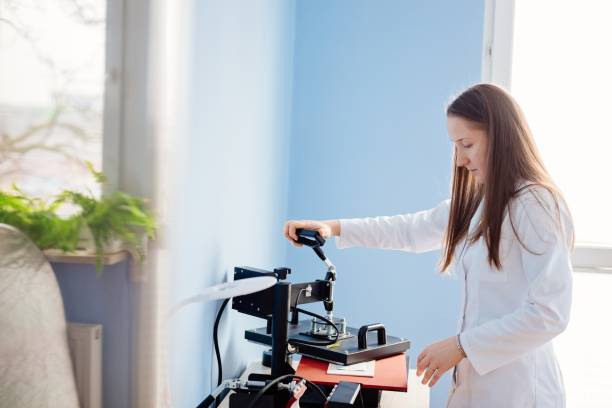 istock Woman in white lab thermal transferring image 643902510
