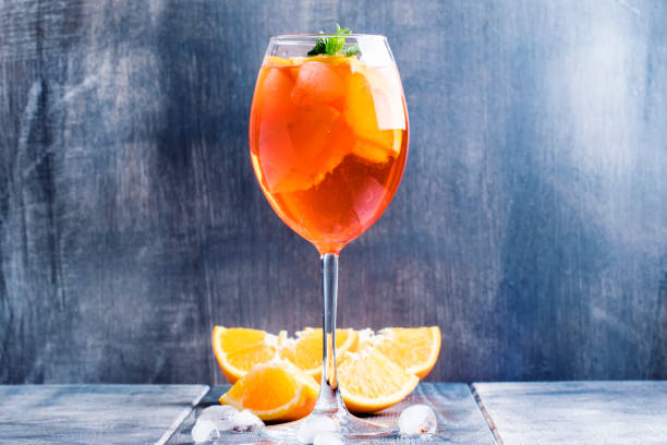 istock Summer cocktail aperitif with orange bitter, fruit, ice and soda 643905342