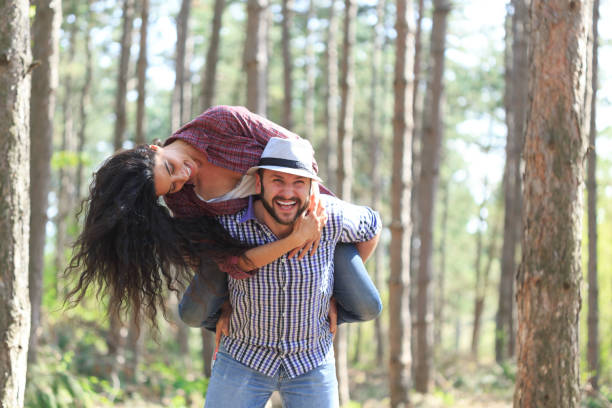 istock Couple tourists having fun in forest 643908276