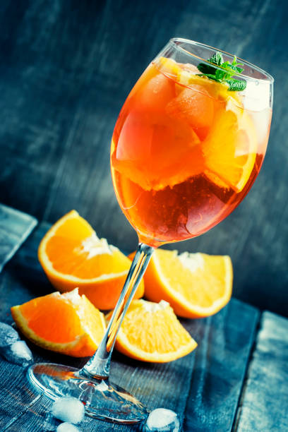 istock Summer cocktail aperitif with orange bitter, fruit, ice and soda 643908292