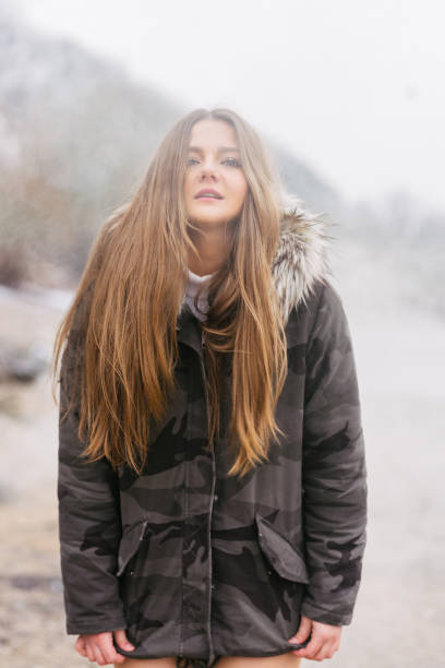 istock trendy girl in jacket outdoor cold 643915930