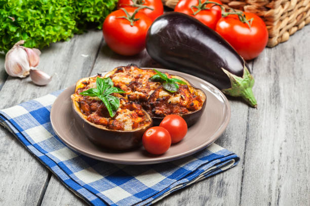 Baked eggplant with pieces of chicken stock photo