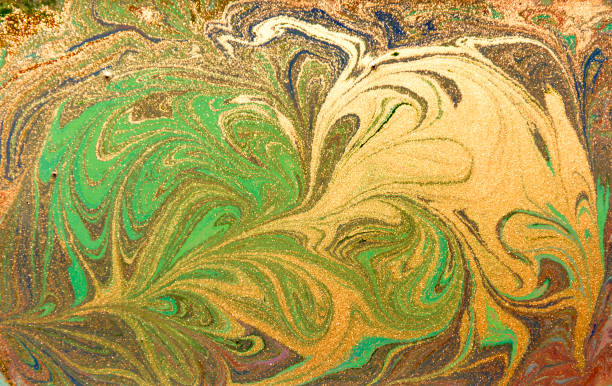 istock Green and golden liquid texture. Hand drawn marbling background. Ink marble abstract pattern 643919648