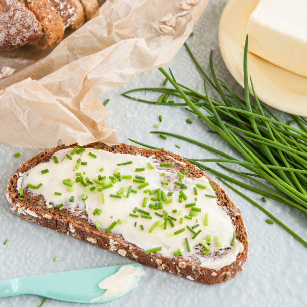 Butter bread with fresh chives stock photo