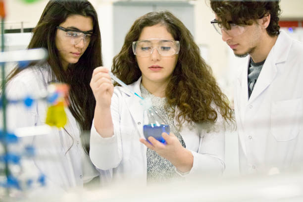 istock University Chemistry Laboratory Research Students Working in Class Together 643930576