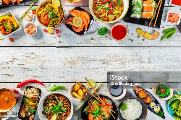 Asian Food Served On Wooden Table Stock Photo - Download Image Now - Asian Food, Chinese Food, High Angle View