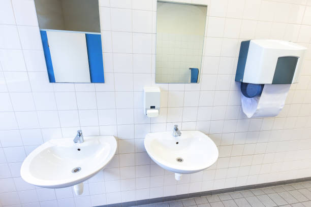 istock Toilet room for men with sinks and mirrors 643937498