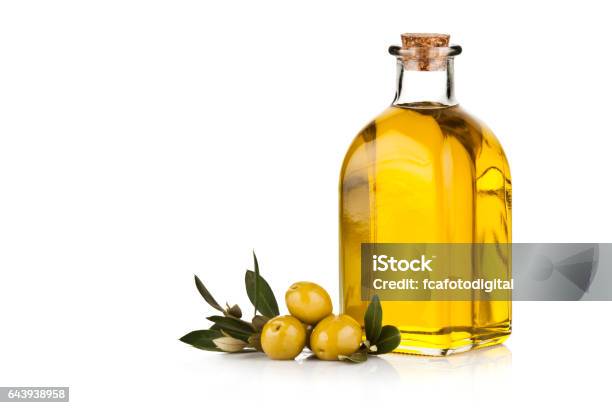 Olive Oil Bottle And Green Olives Isolated On White Background Stock Photo - Download Image Now