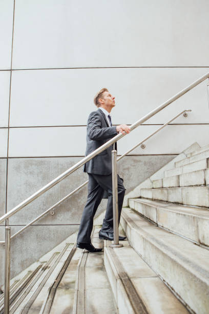 istock Businessman on the stairs 643941460