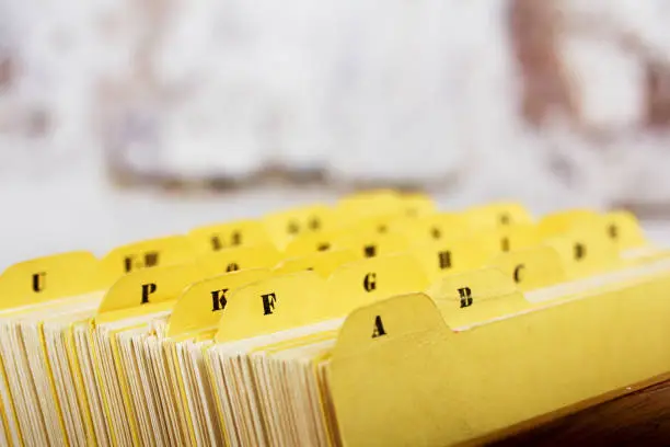 Close up of alphabetical index cards in a box