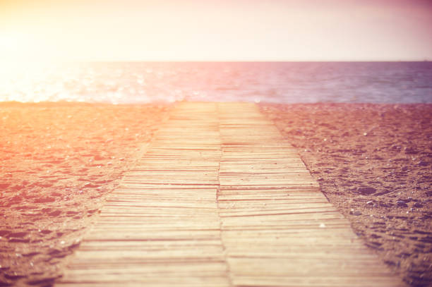 wooden walkway on the beach on a sunny day