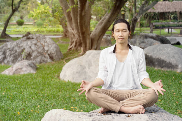 istock man is reaxing in park. 643943876
