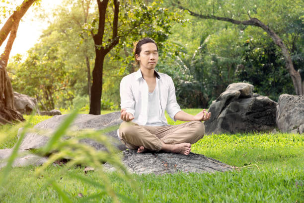 istock man is reaxing in park. 643943930