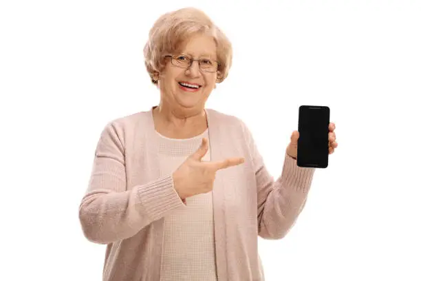 Photo of Mature lady holding a phone and pointing