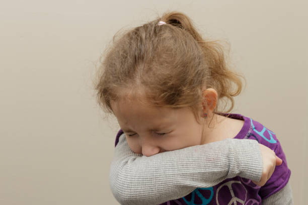 istock sneezing girl 643949784