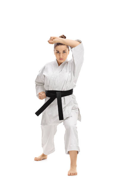 istock Girl wearing a kimono doing a karate kata 643949852