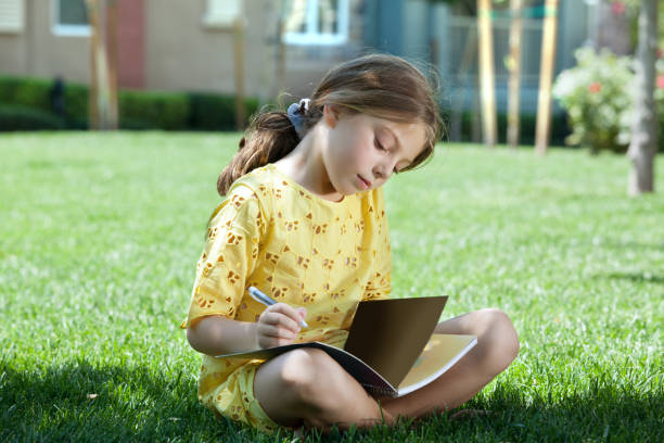 girl on grass stock photo