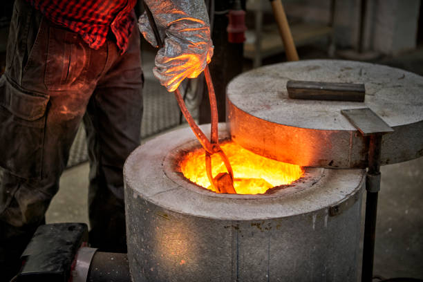 istock Checking up on the melted metal in oven 643950722