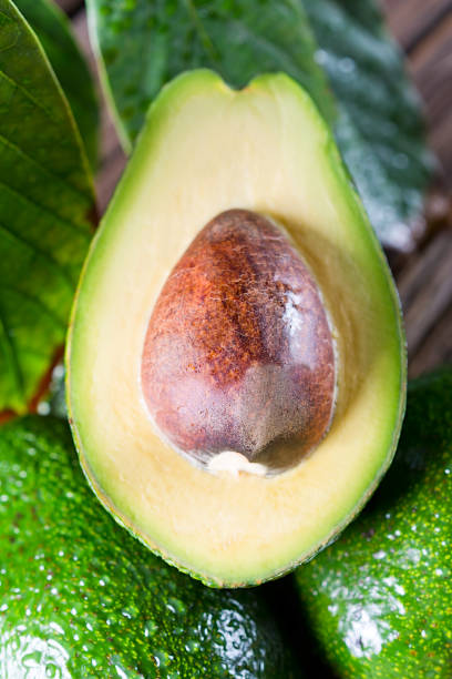 istock Fresh organic avocado on old wooden table. 643950826