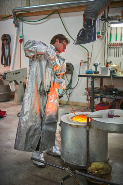 istock Checking up on the melted metal in oven 643953174