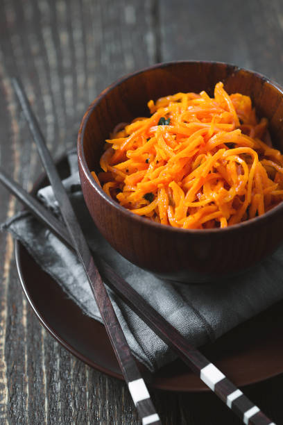 istock Carrots in Korean with spices and chopsticks 643953990