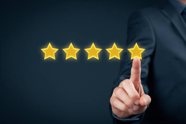 Review concept Review, increase rating or ranking, evaluation and classification concept. Businessman click on five yellow stars to increase rating of his company."n first class photos stock pictures, royalty-free photos & images