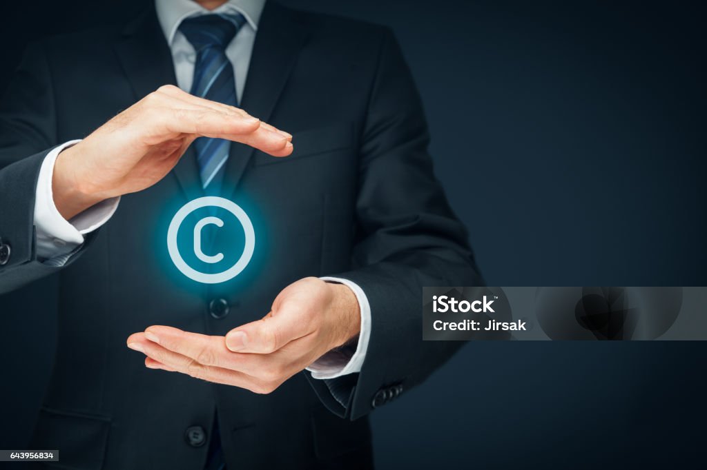 Copyright, patents and intellectual property Copyright, patents and intellectual property protection law and rights. Left composition. Intellectual Property Stock Photo