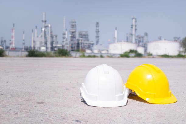 istock helmet on floor in oil refinery ,safety concept 643965656