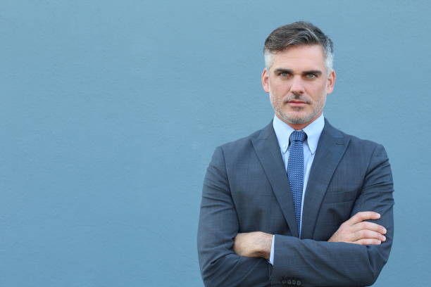 istock Business magnate with arms crossed 643974034