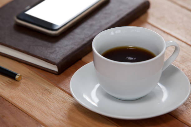 istock Black coffee with organizer and mobile phone 643976774