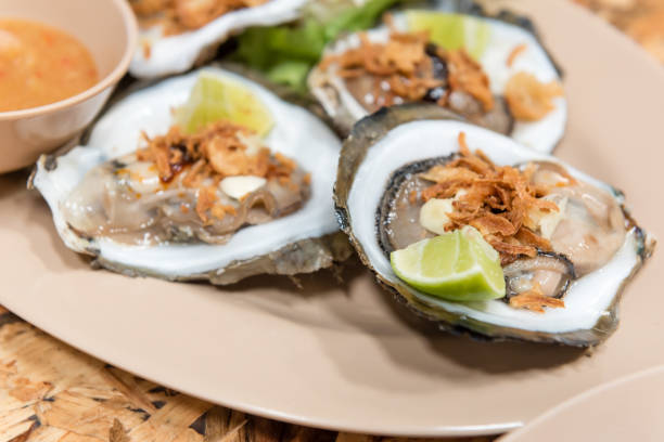 istock thai style raw oyster served with lime and seafood sauce 643981854