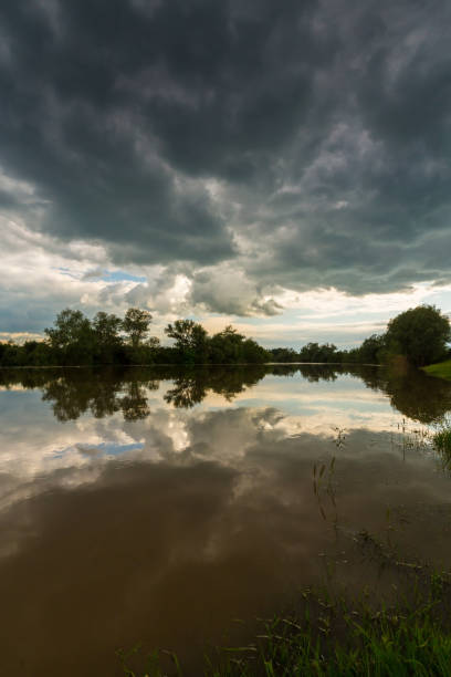 istock Ominous stormy sky over natural lake 643984418