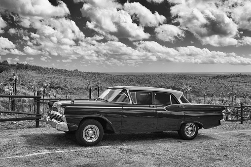 Pinar del Rio, Cuba - January 29,2017: Old Ford Fairlane on the road in Valley de Vinales. Thousands of these cars are still in use in Cuba and they have become an iconic view and a worldwide known attraction