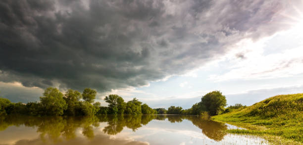 istock Ominous stormy sky over natural lake 643985164