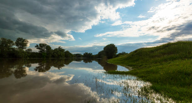 istock Ominous stormy sky over natural lake 643987568