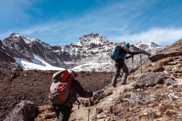 istock Mountain Climbers walking up on rocky Footpath 643990892