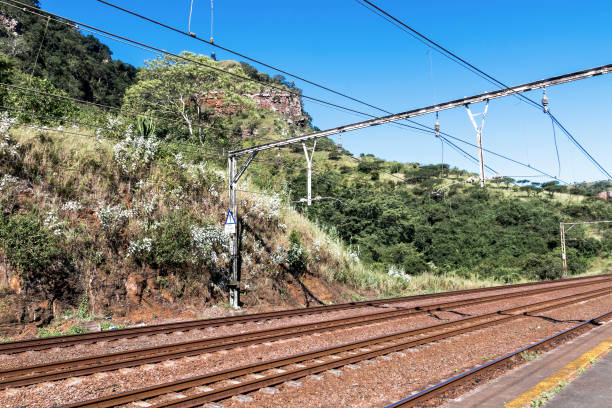 istock Twin Rail Tracks Leading Through Rural Railway Station 643991516