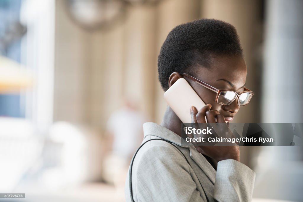 Corporate businesswoman talking on cell phone  25-29 Years Stock Photo