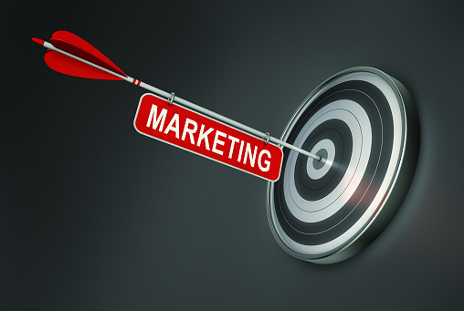 3d rendering of target and arrow with the word marketing