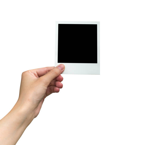 istock hand holding photo frame on isolated white with clipping path. 644005410