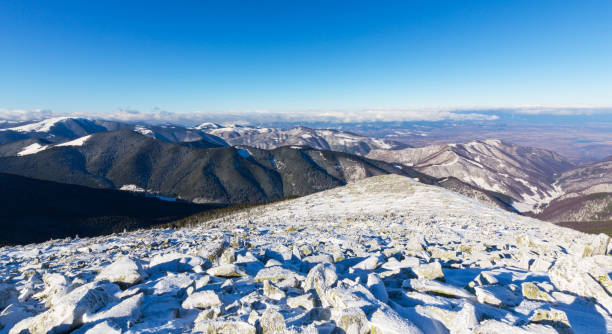 istock Bright winter scenery in the mountains, with frost and rocks 644017874