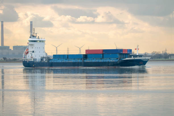 istock Feeder ship. Cargo vessel on industrial river. 644021194