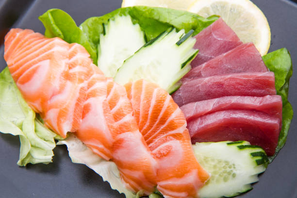 istock tuna and salmon sashimi on black dish 644024388